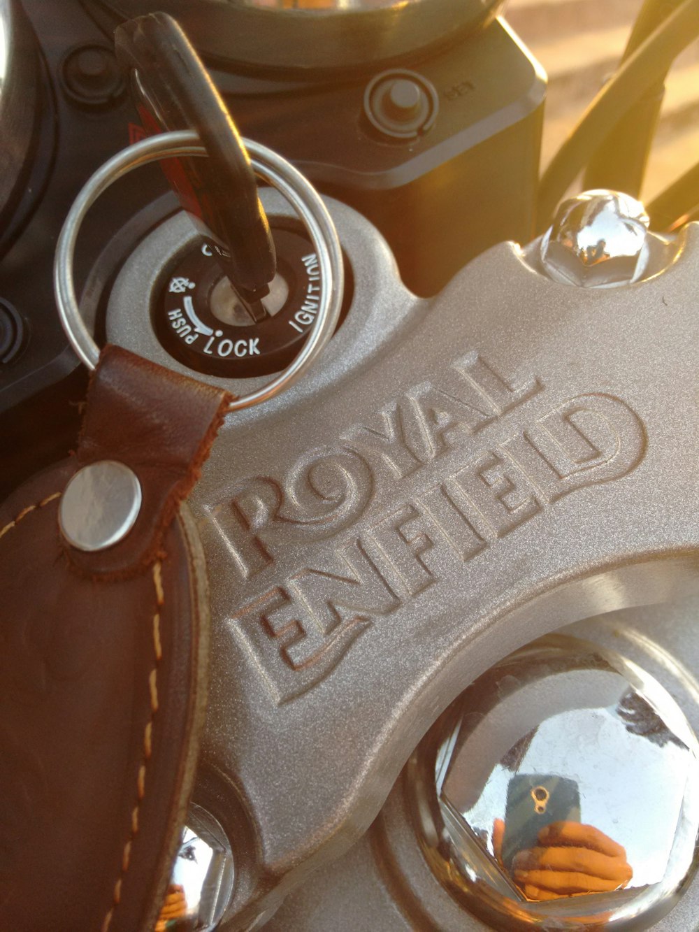 a close up of a motorcycle with a mirror on it