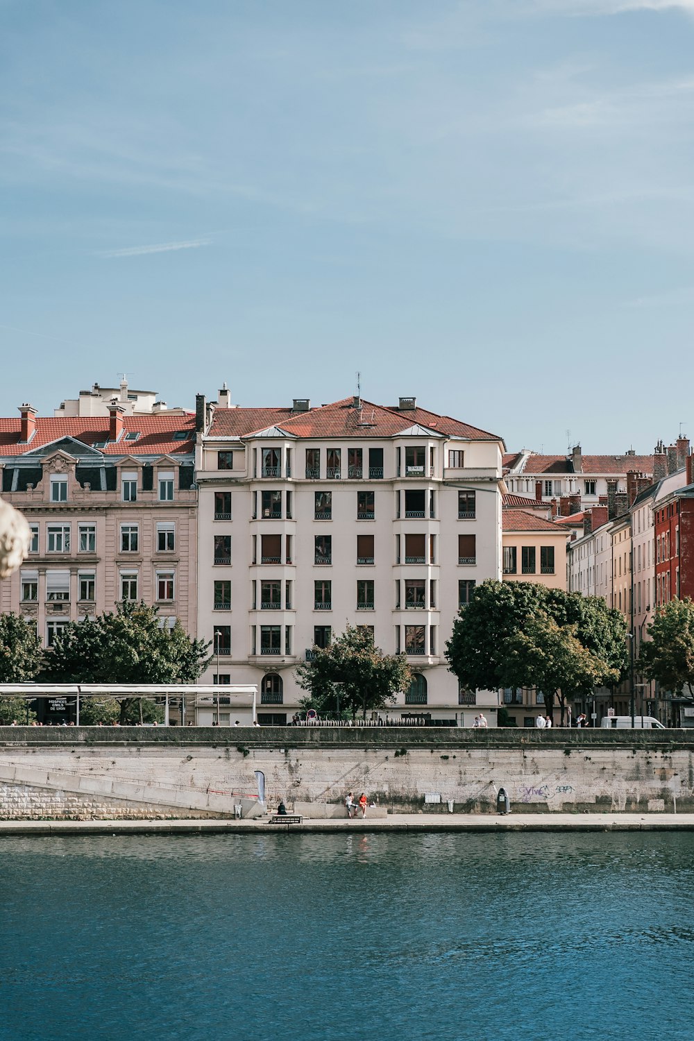 a body of water with buildings in the background