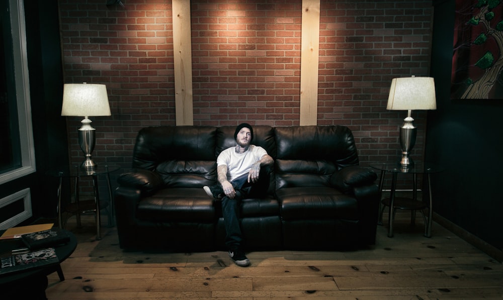 a man sitting on a couch in a living room