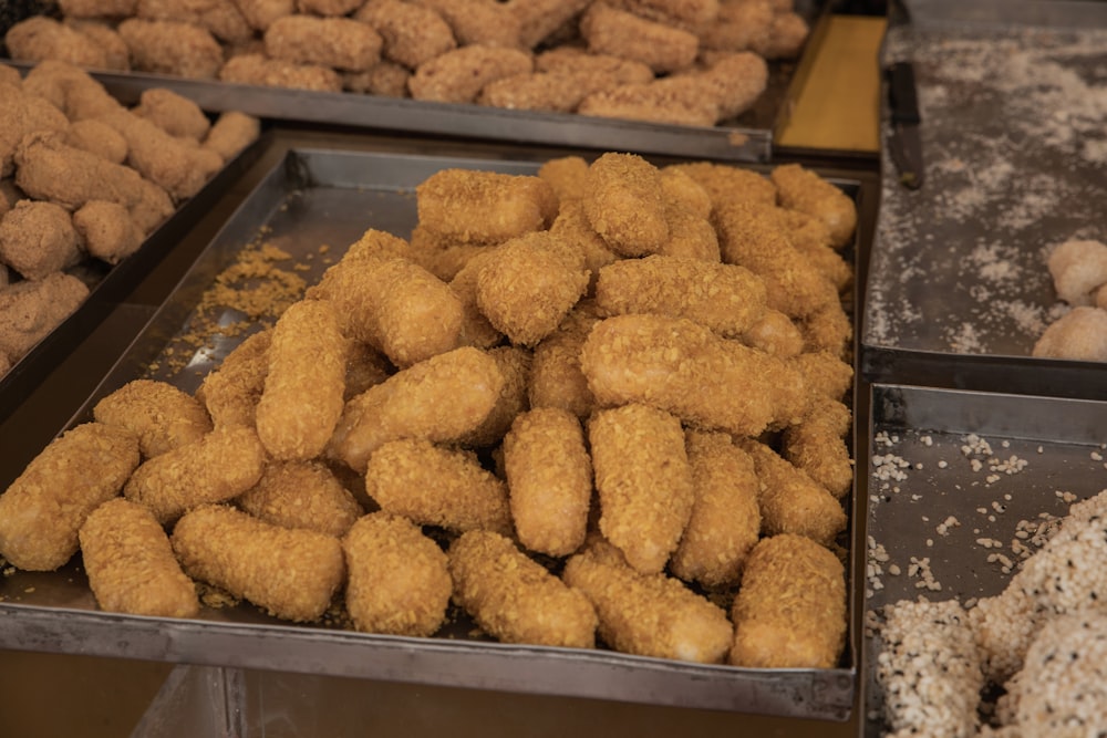 a bunch of doughnuts that are on a tray