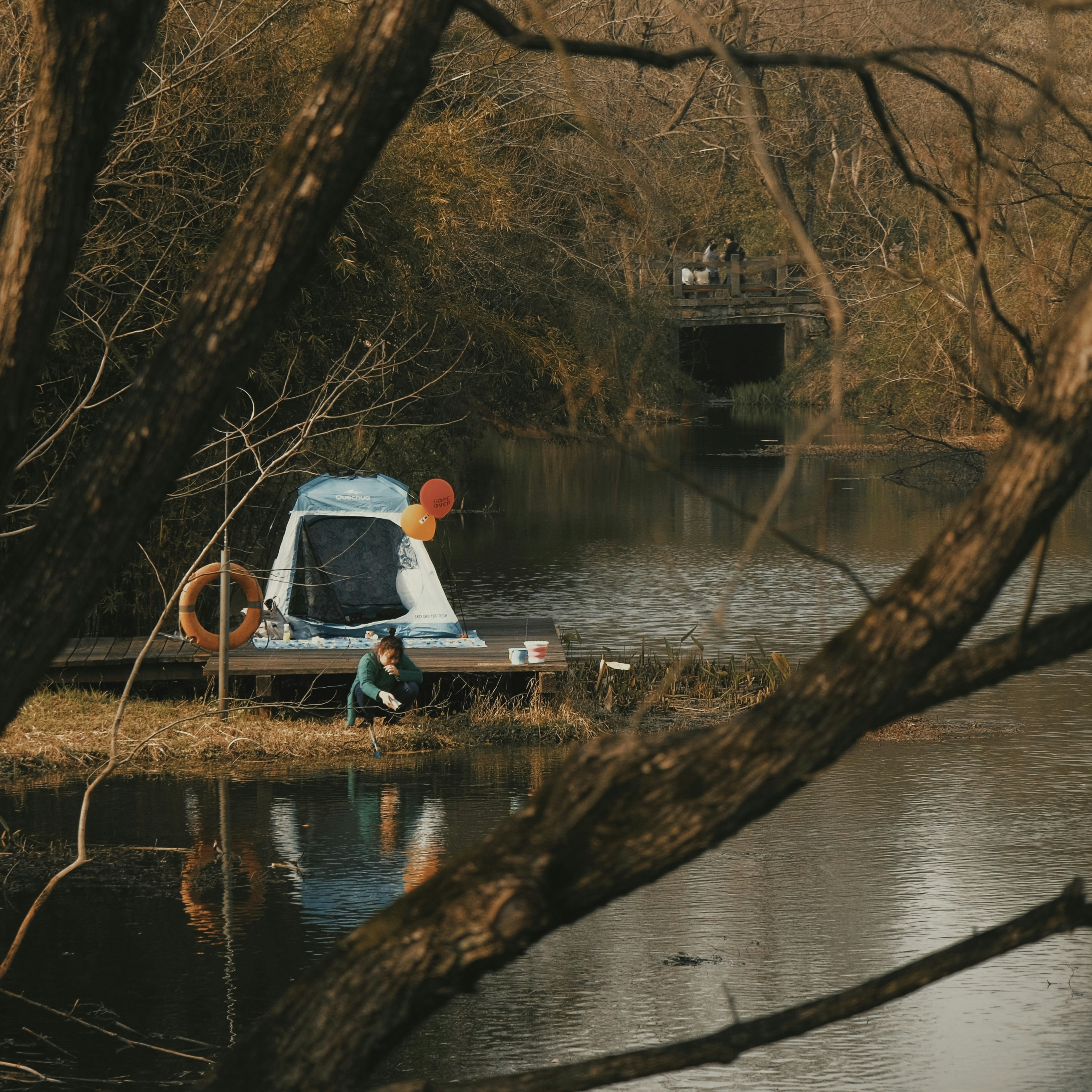 a truck parked on the side of a river