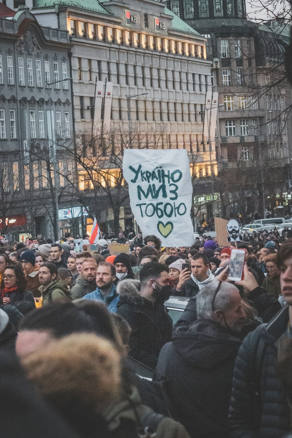 a large group of people holding up signs