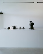 Modern coffee grinder and espresso machine on a minimalist kitchen counter