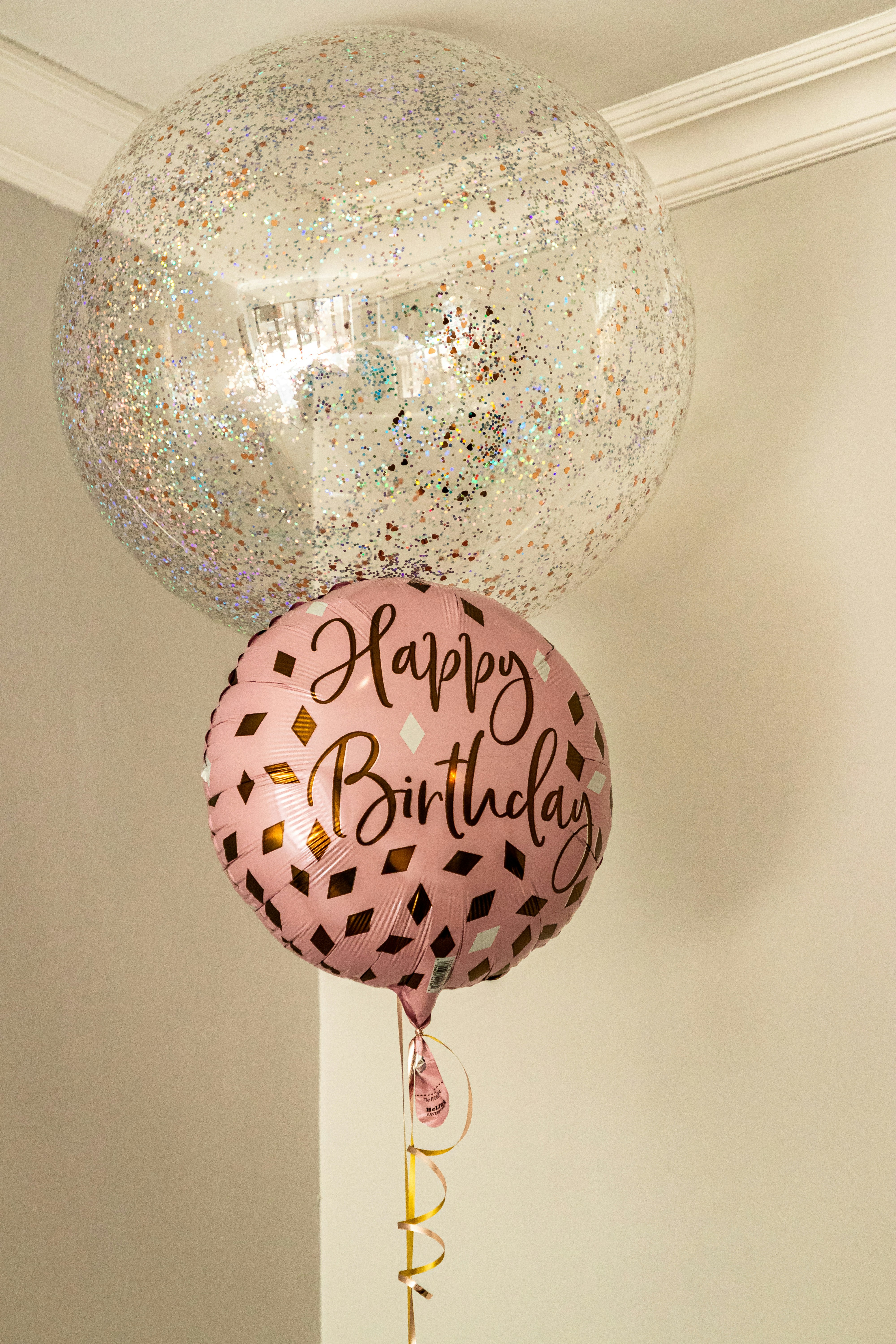 a couple of balloons that are on a wall