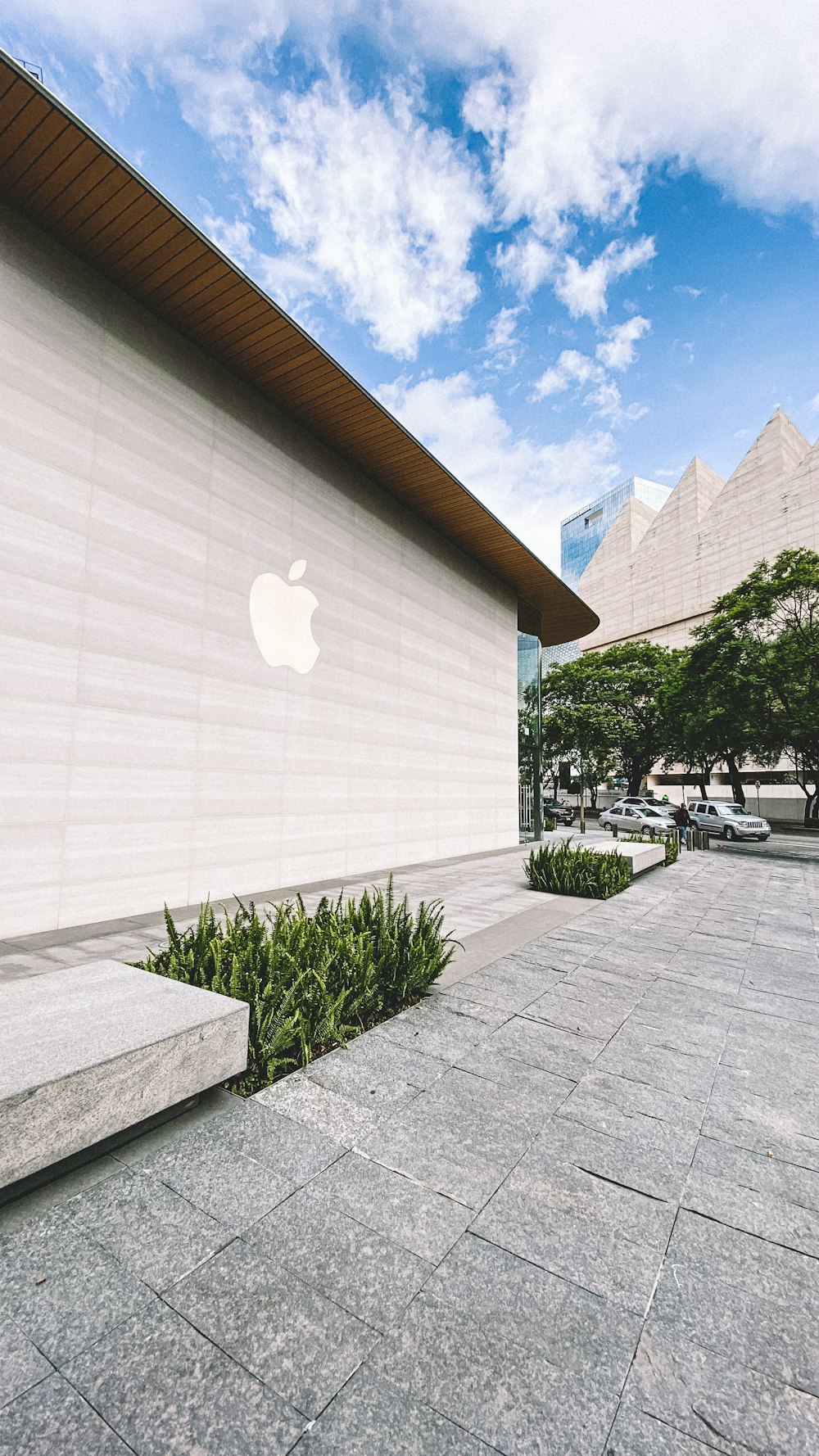 a building with a large apple logo on the side of it