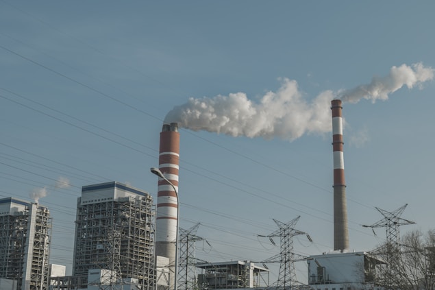 a factory with smoke coming out of it's stacks