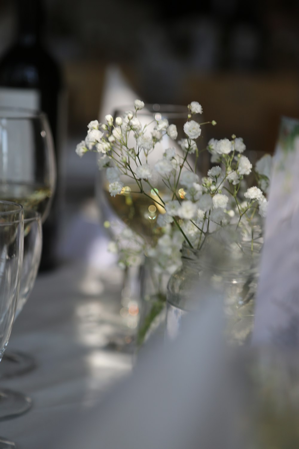 a close up of a vase of flowers on a table