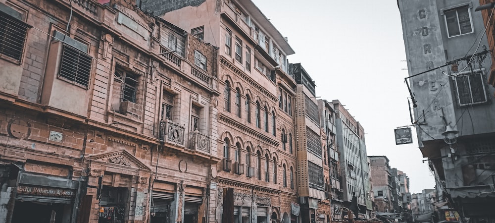 a row of old buildings on a city street