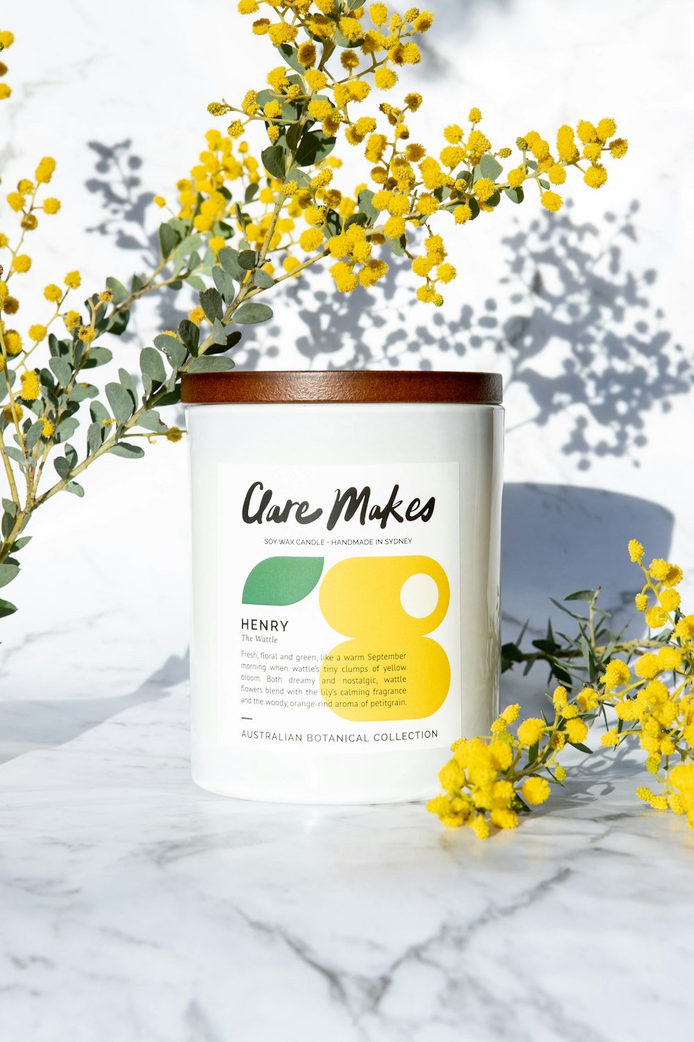 a can of pureed honey surrounded by yellow flowers