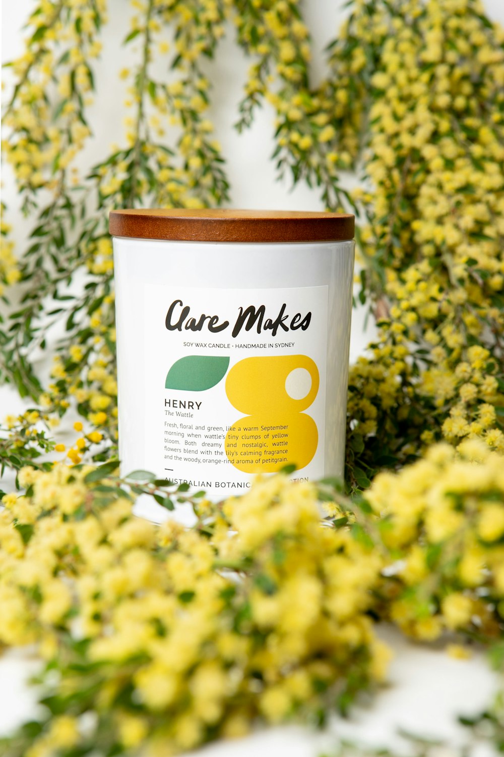 a can of care makes surrounded by yellow flowers