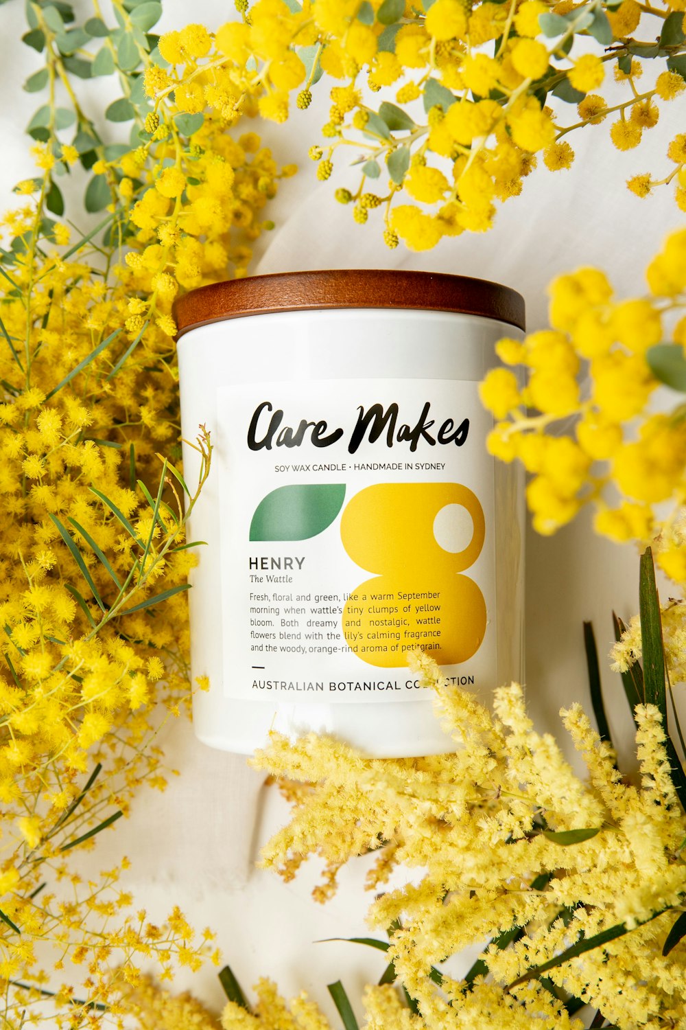 a can of care makes on a table with yellow flowers