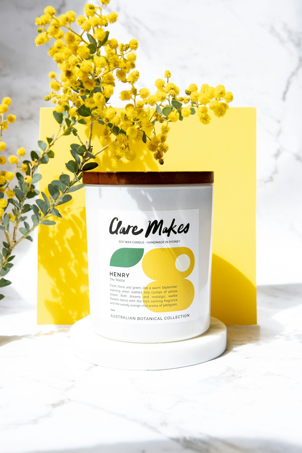 a can of care mixes next to some yellow flowers