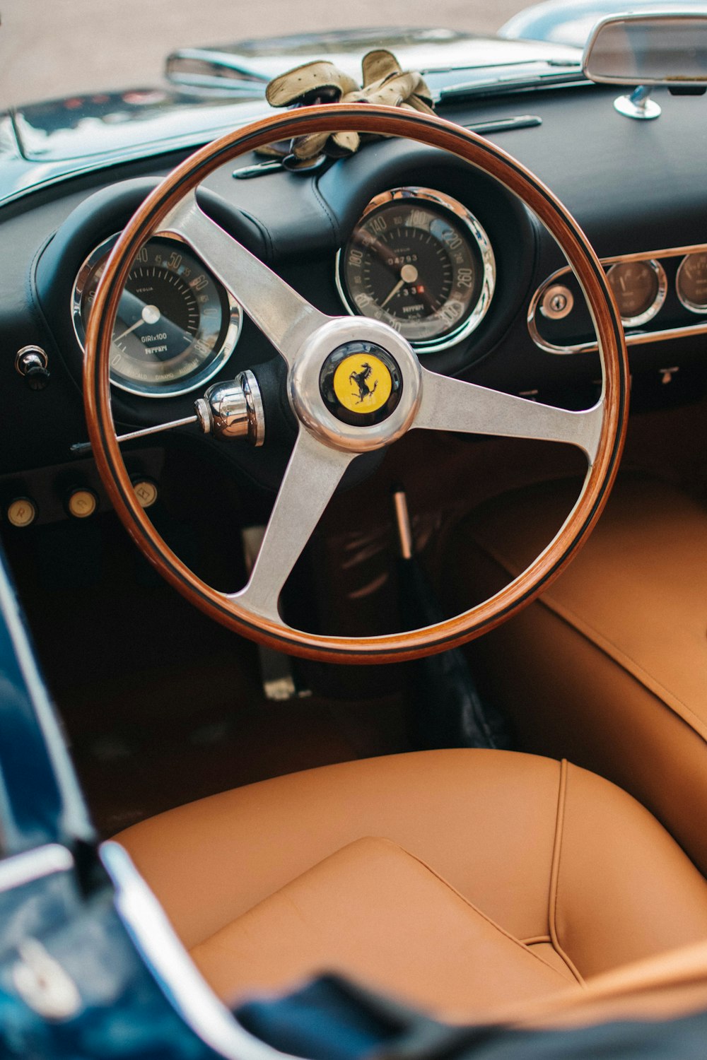 the interior of a classic car with a steering wheel