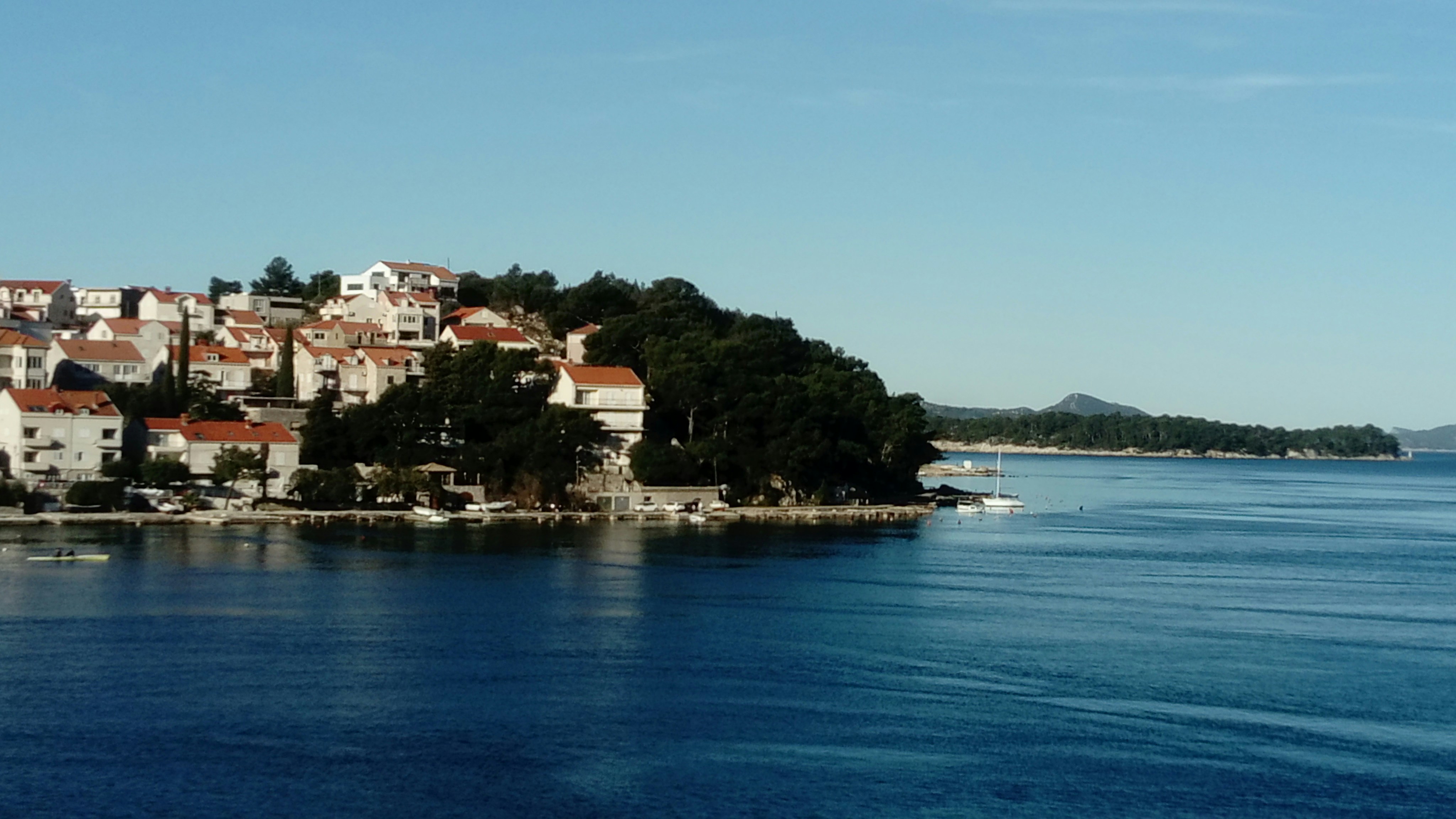 A small island in the middle of a body of water