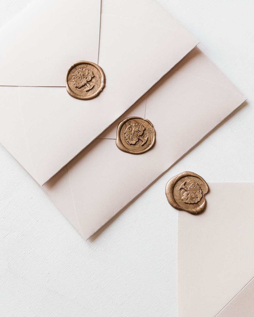 a close up of a pair of stamps on a white envelope