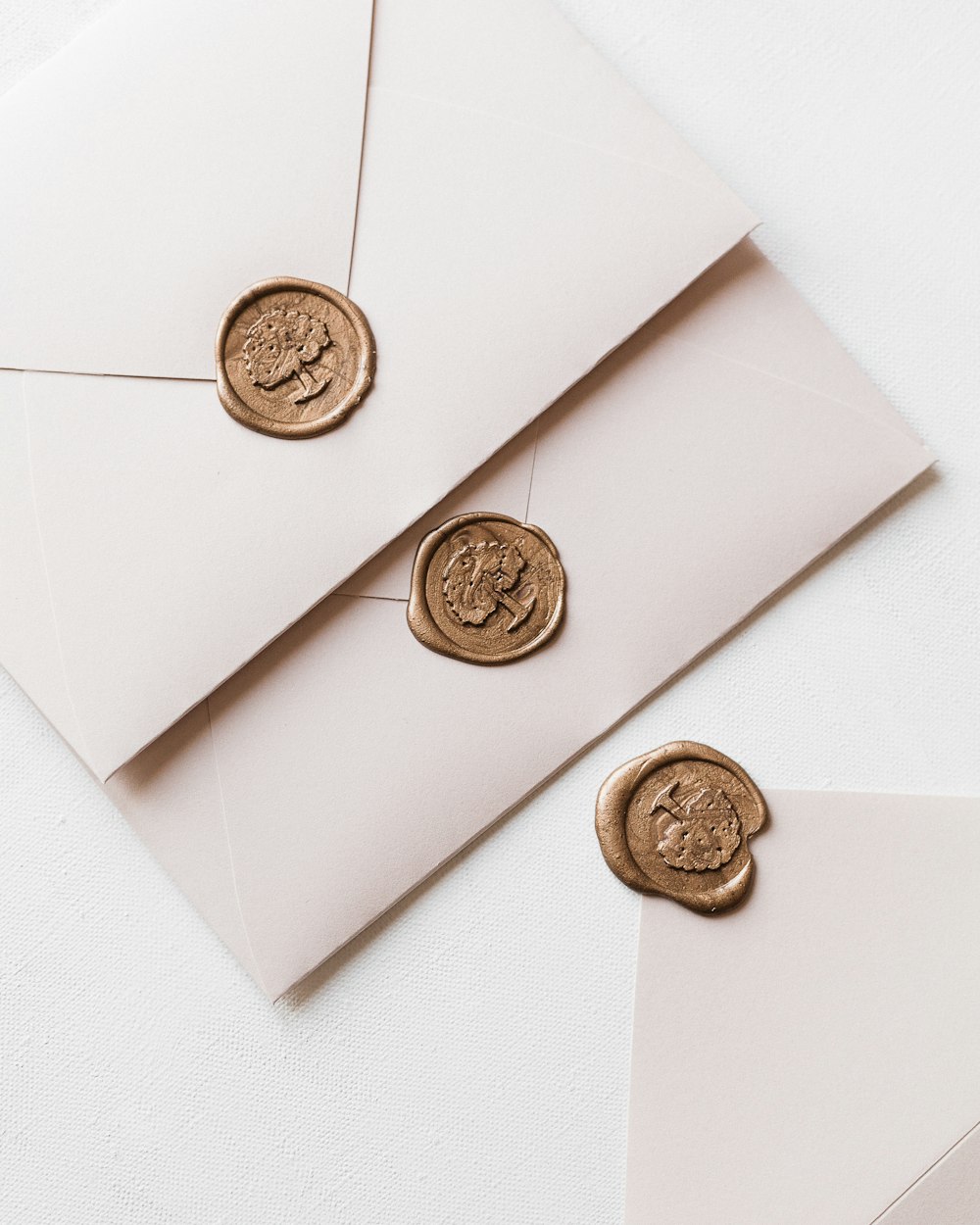 a close up of a envelope with a wax stamp on it