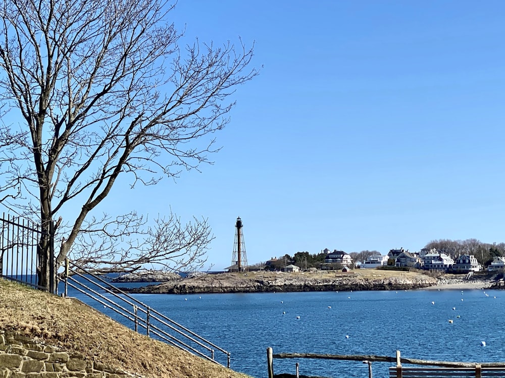 a view of a body of water with a lighthouse in the background