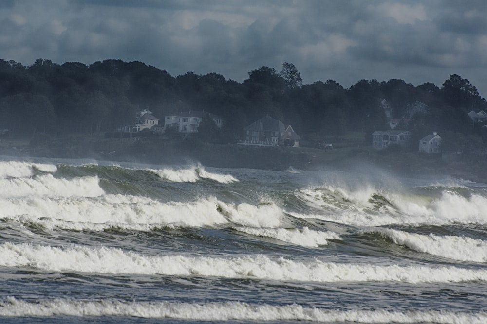 a person riding a surfboard on top of a wave