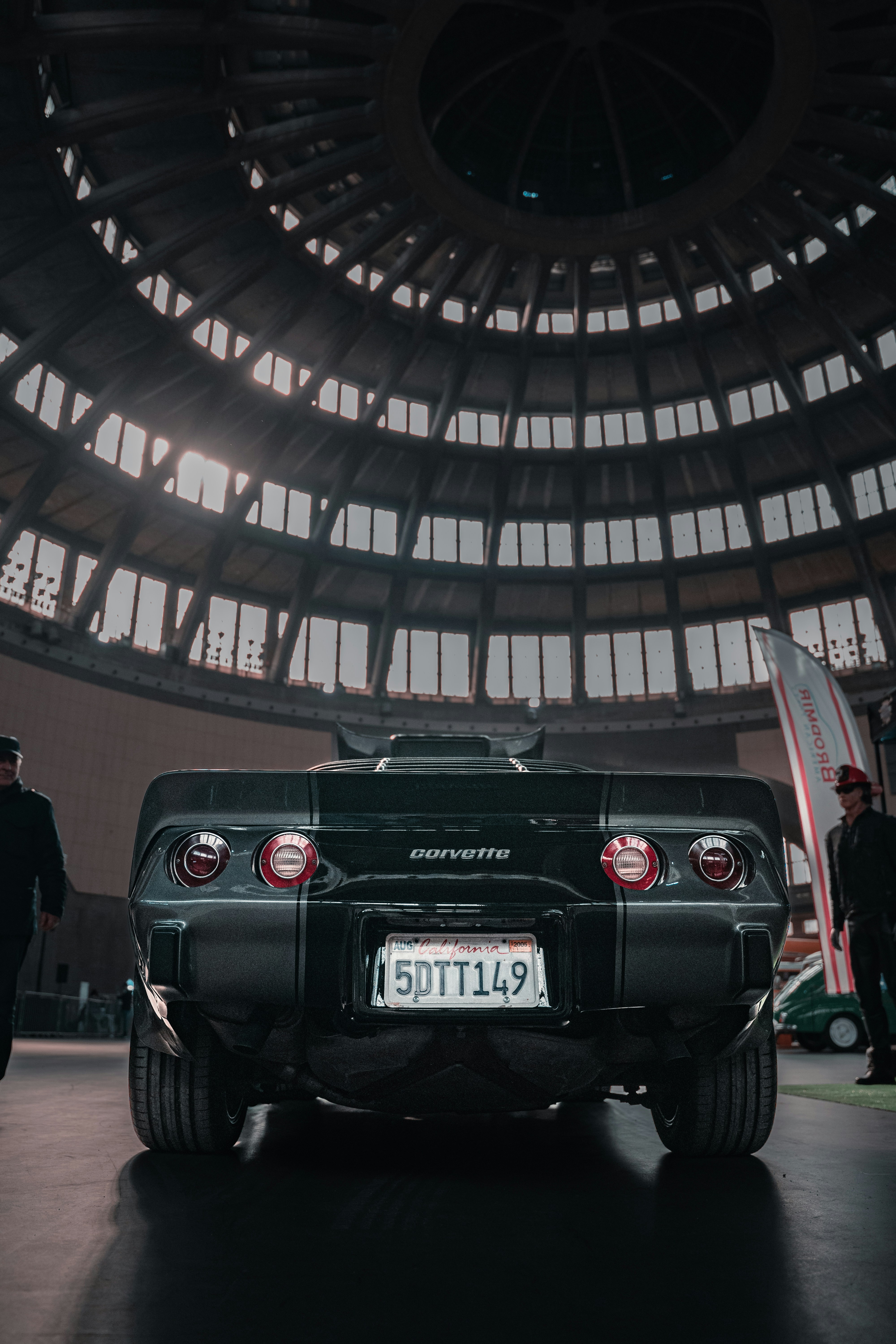 a black sports car parked in a building