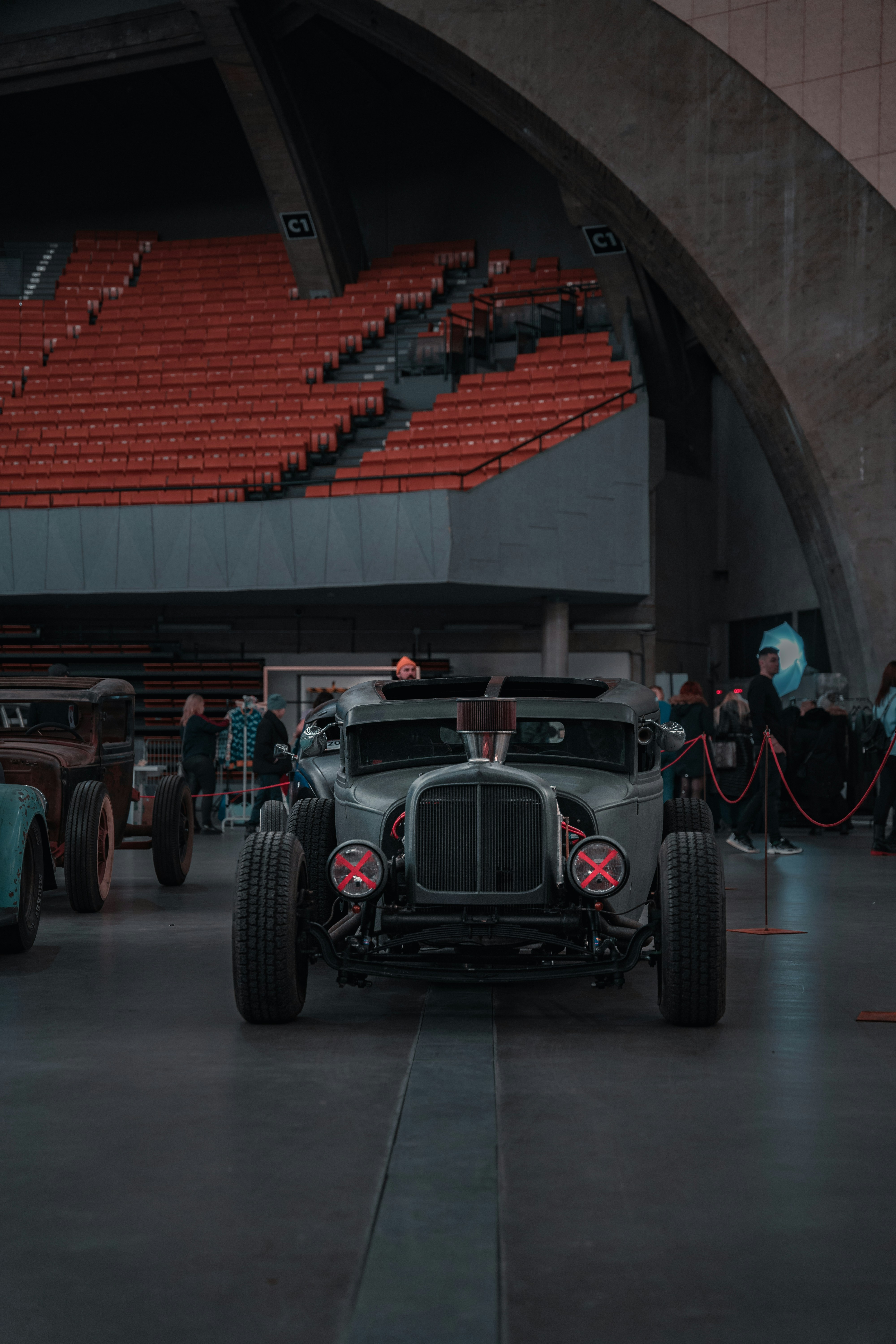 a group of cars parked inside of a building