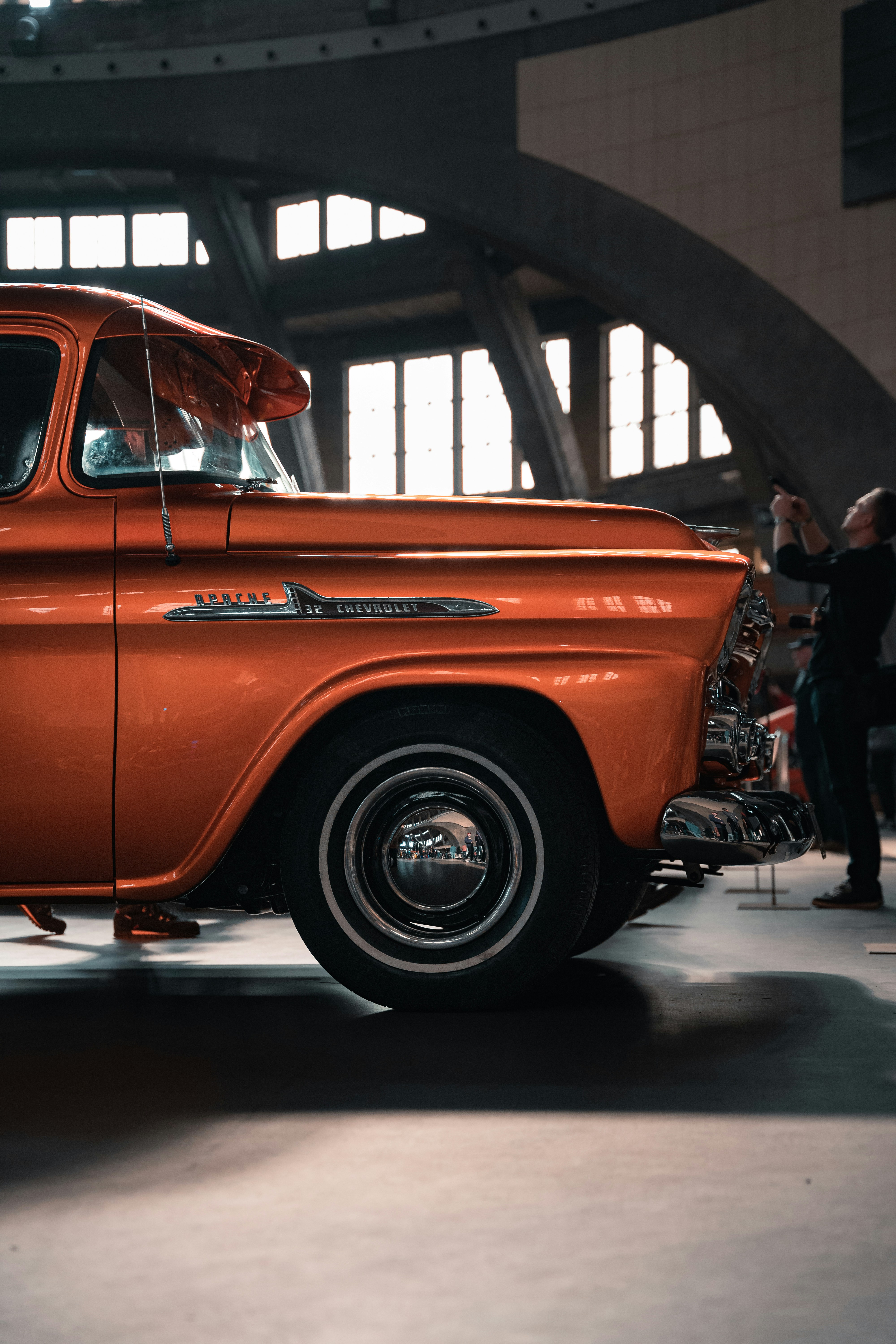 an orange truck parked inside of a building