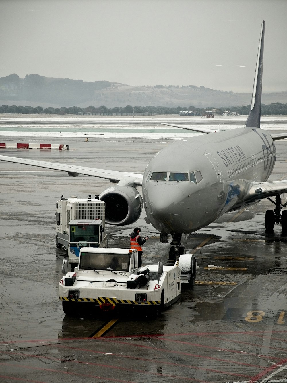 a large jetliner sitting on top of an airport tarmac