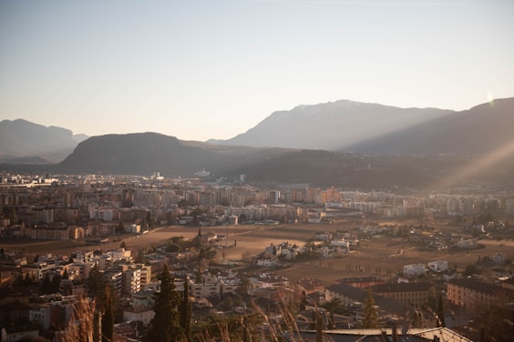 a view of a city with mountains in the background