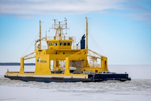 a large yellow boat in the middle of the water