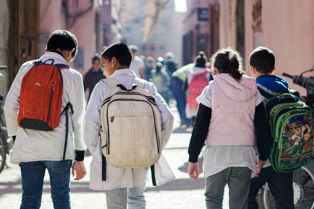 a group of people walking down a street