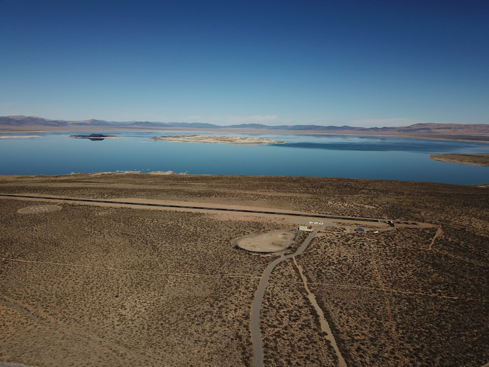 a large body of water sitting in the middle of a desert