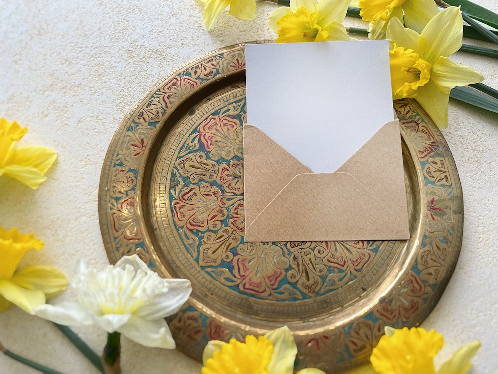 a paper envelope sitting on top of a plate