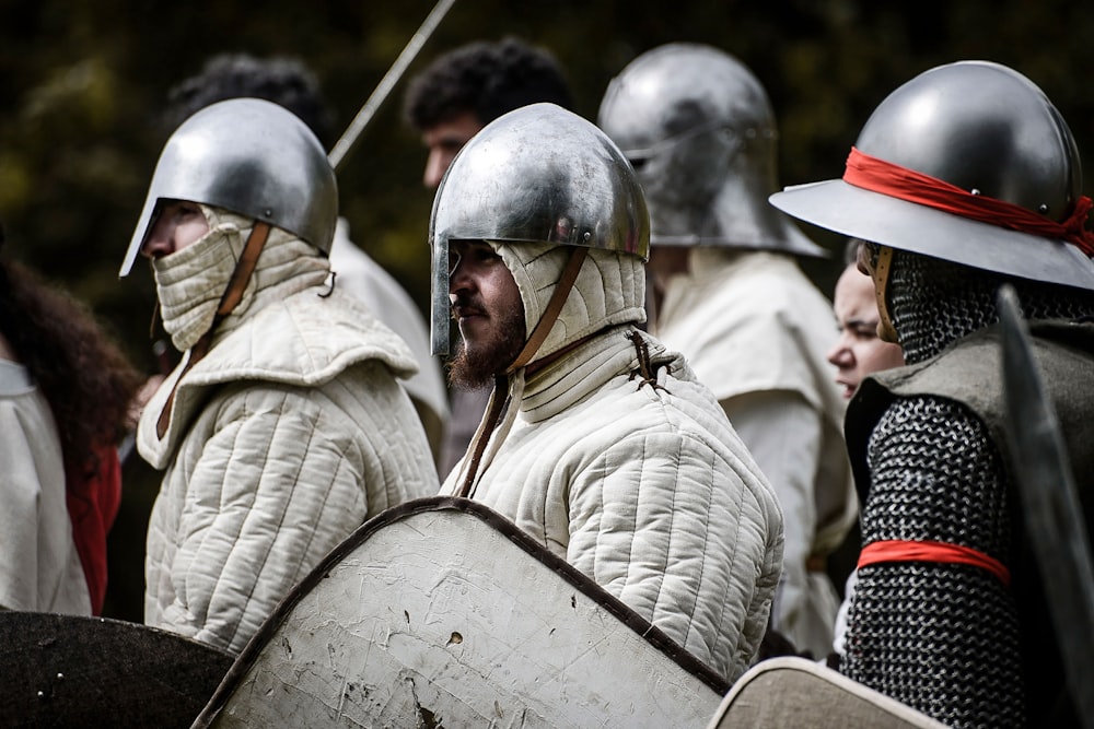 a group of men in armor standing next to each other