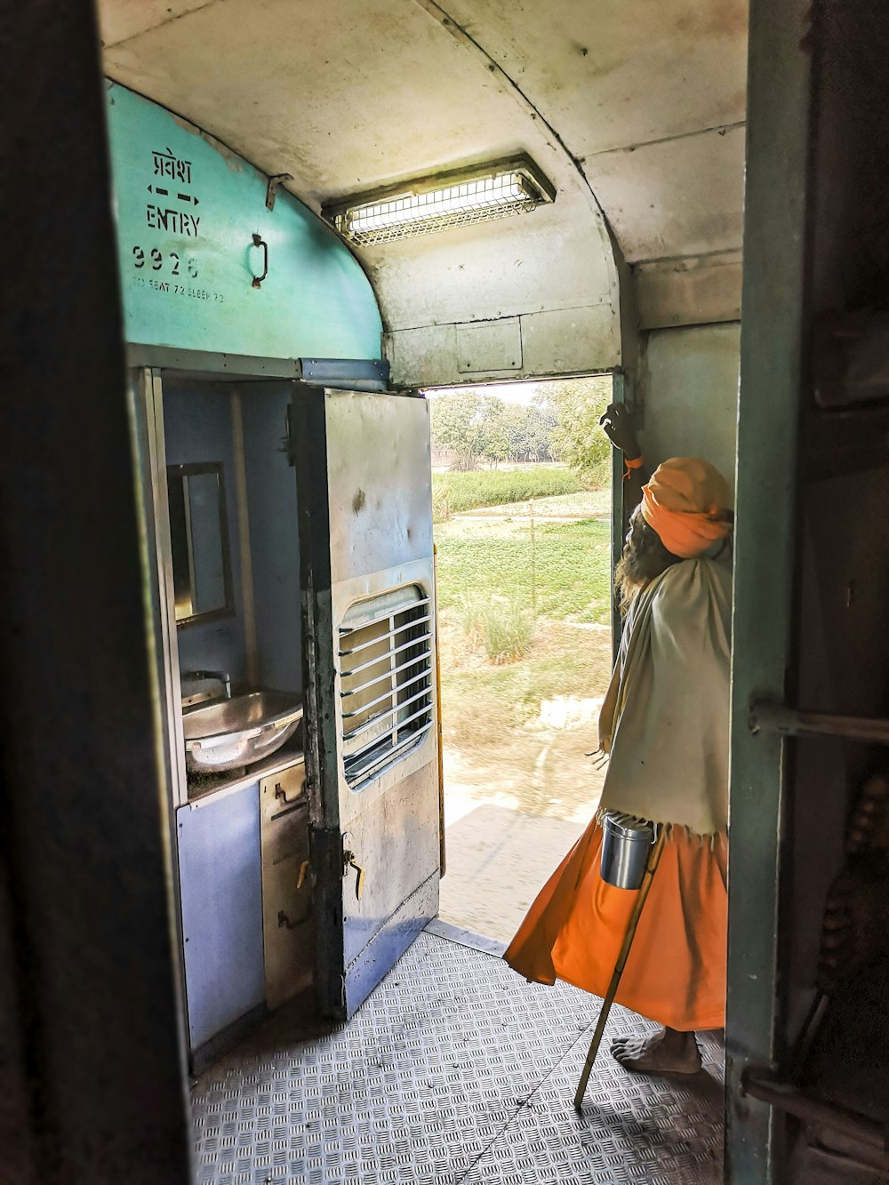 a woman standing in a doorway of a train