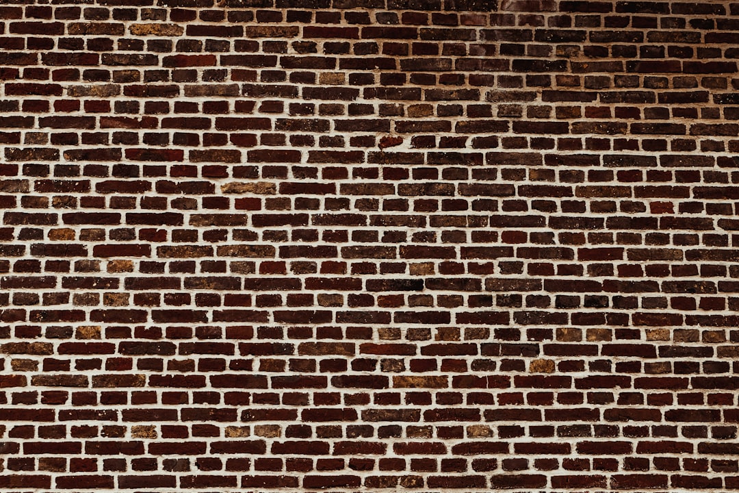 a brick wall with a stop sign on it, brick wall texture