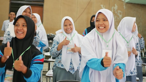 a group of young women standing next to each other