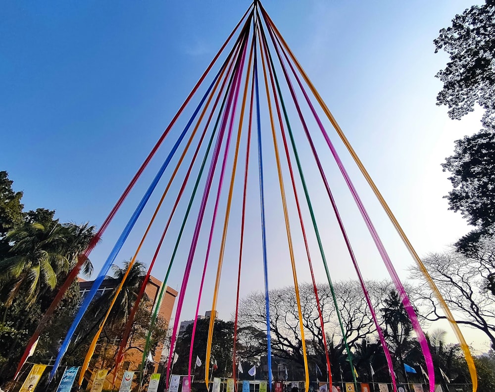 a tall pole with many colored sticks sticking out of it