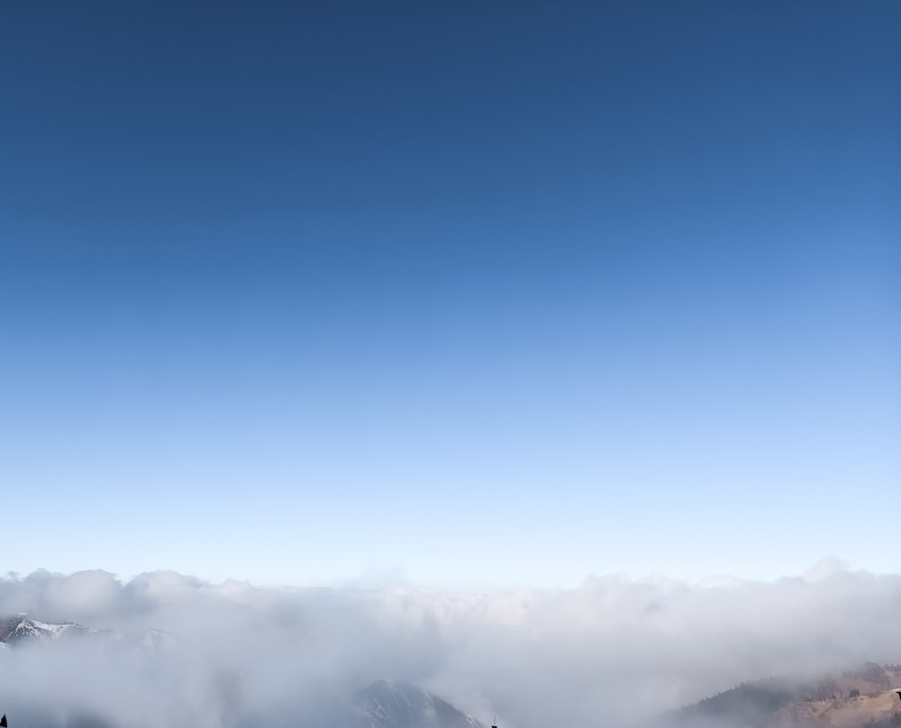 a group of people standing on top of a snow covered slope