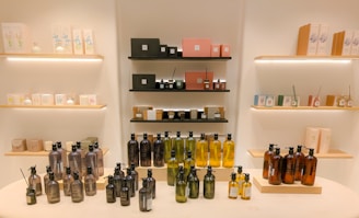 a table topped with lots of bottles of liquid