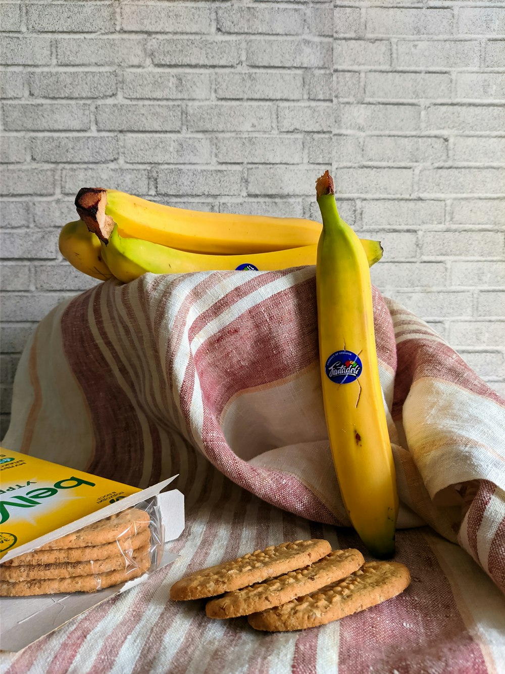 a bunch of bananas sitting on top of a blanket