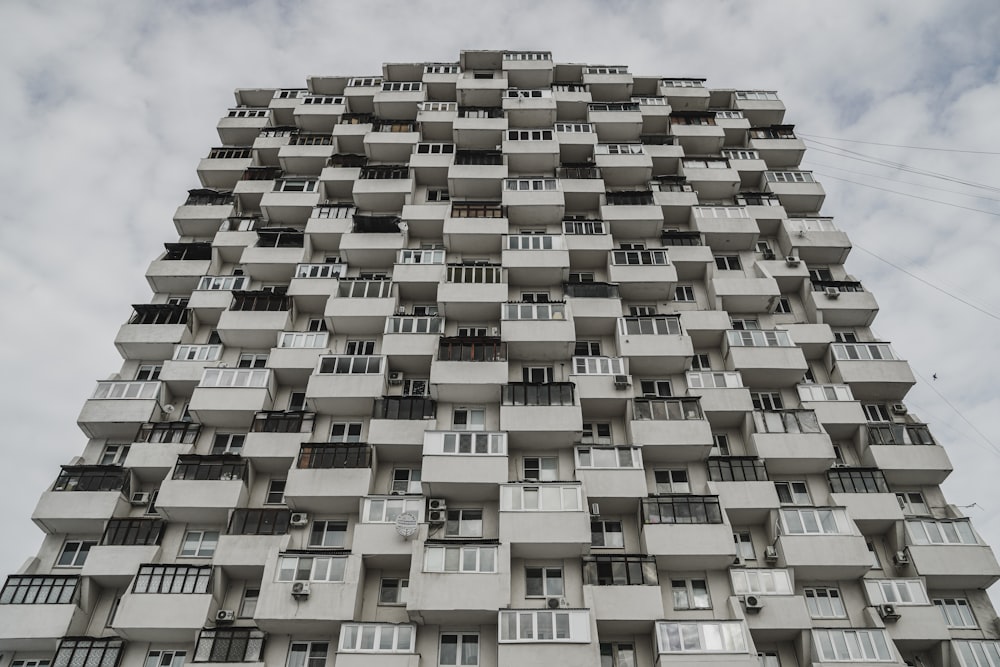 a very tall building with balconies and windows