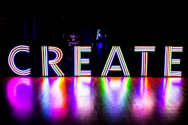 the word create is lit up in the dark