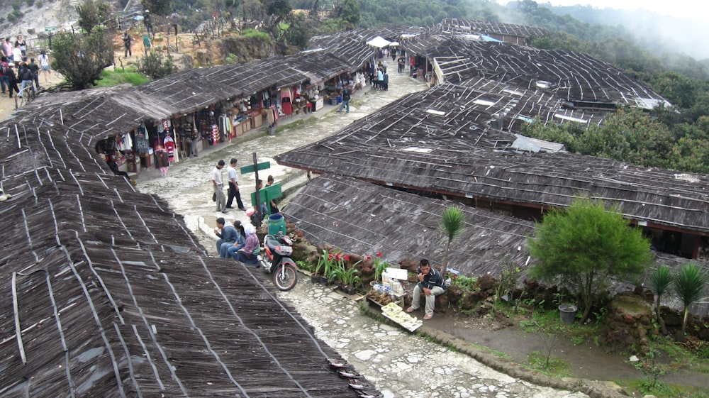 a group of people standing on top of a roof