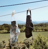 a couple of bags hanging from a clothes line