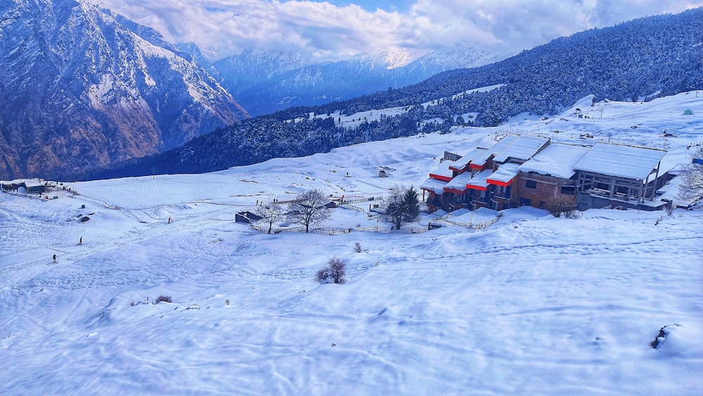 a house in the middle of a snowy mountain