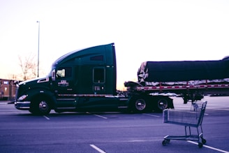 a large semi truck with a shopping cart in front of it