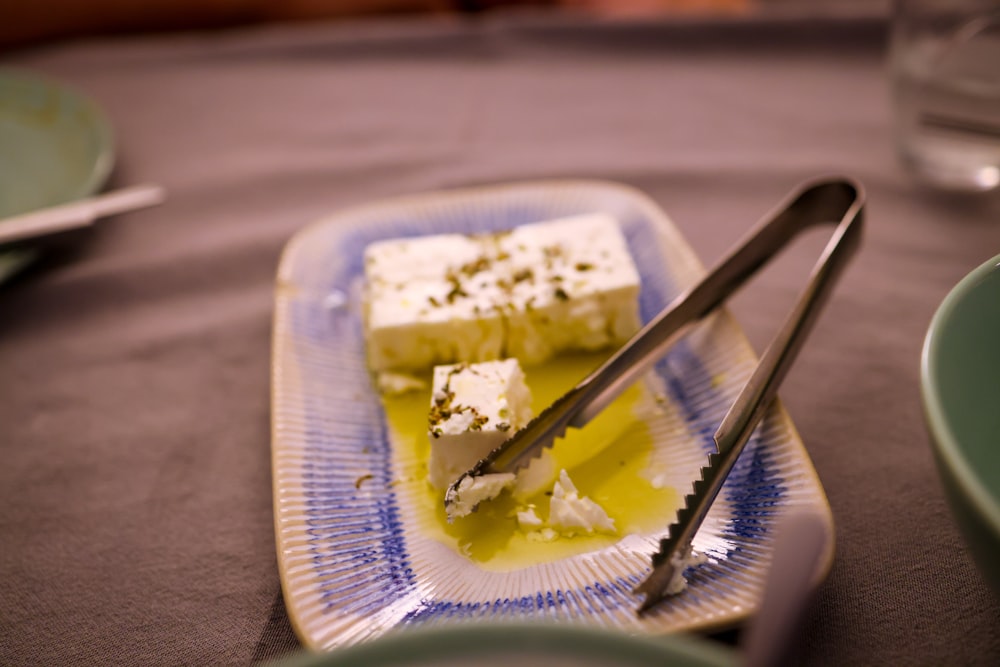 a plate of food with a knife and fork on it