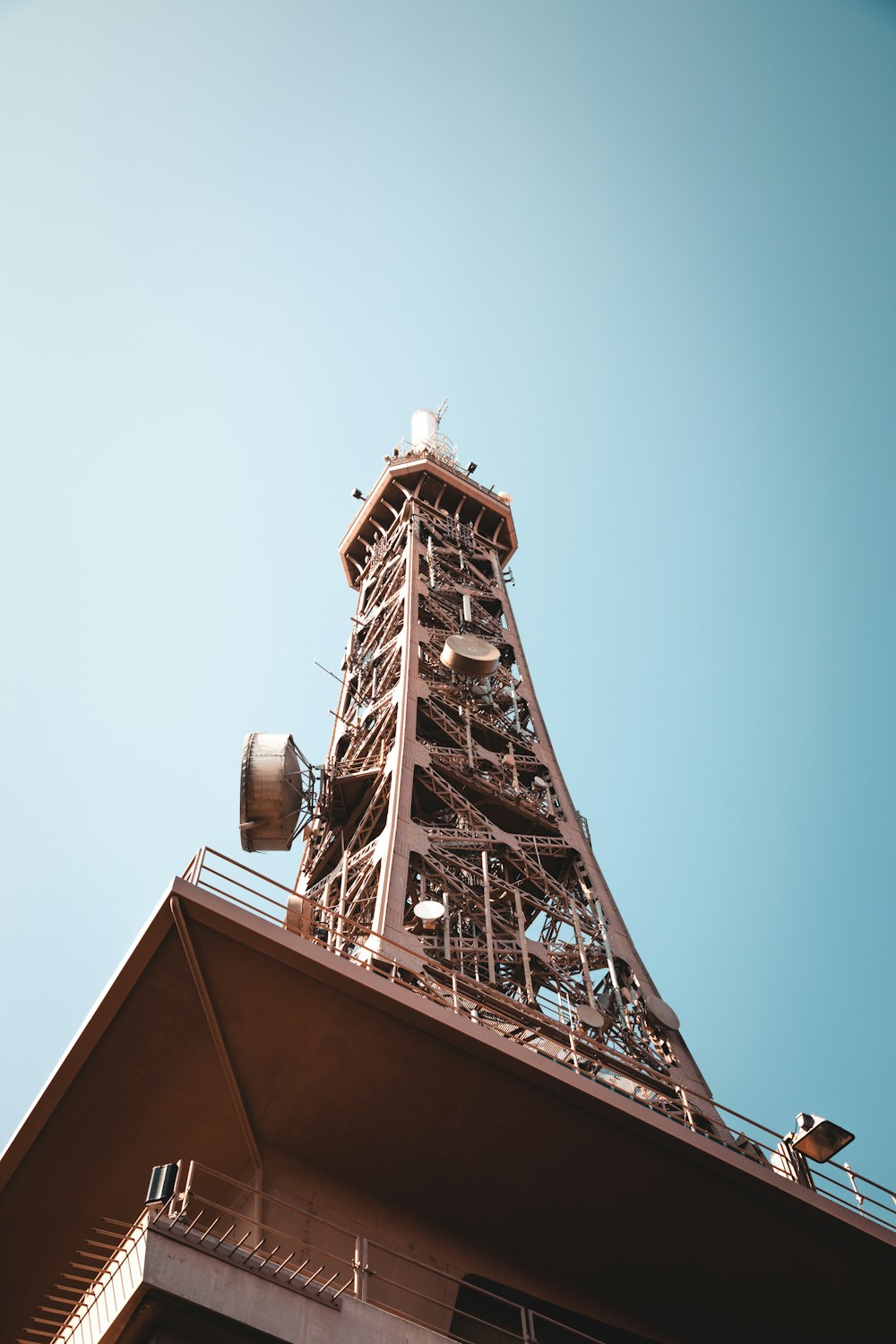 a large tall tower with a clock at the top of a building