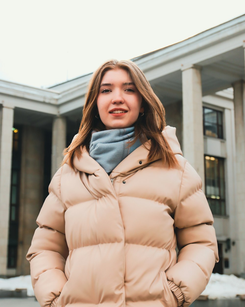 a woman standing in front of a building