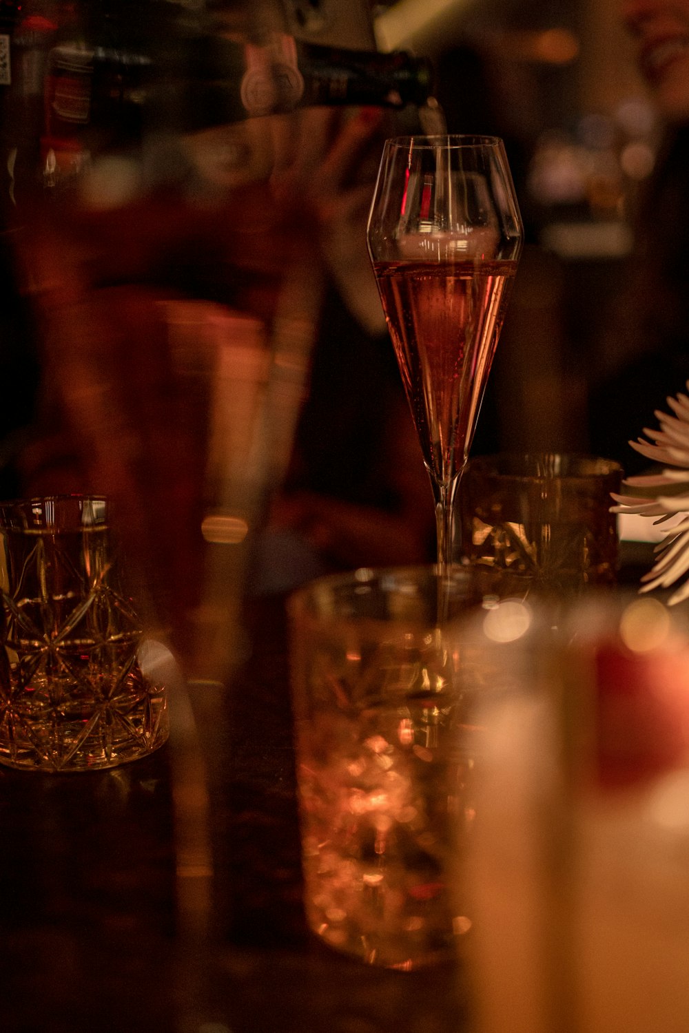 a close up of a wine glass on a table