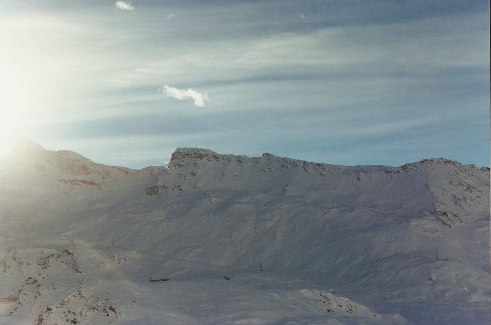 a person riding skis on a snowy surface